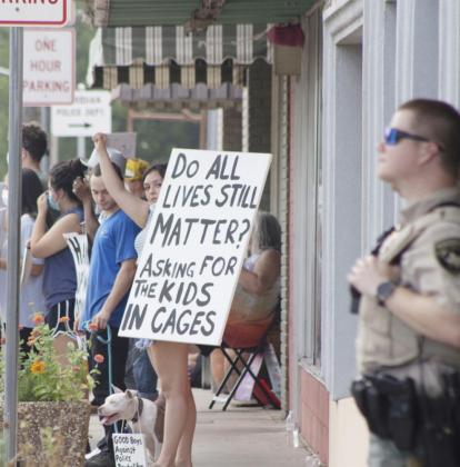 Meridian resident Yreli Lovaton holds up a sign against the detention of illegal-immigrant children in cages Wednesday in downtown Meridian. Lovaton and others were protesting as part of the Black Lives Matter protests. Allen D. Fisher | The Clifton Record
