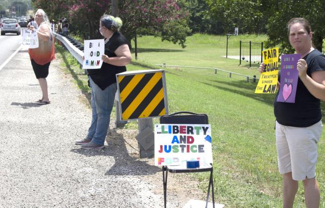 Protesters hold up signs for Black Lives Matter movement at the roadside near the Bosque River Wednesday in Meridian. Allen D. Fisher | The Clifton Record