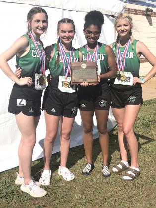 The girls relay team advances to state competition with their first and third place wins in the 4x200 and 4x100 relays respectively.  Shown abover are Elise Webb, Katelyn Hunt, April Rowlins and Ava Anderson.