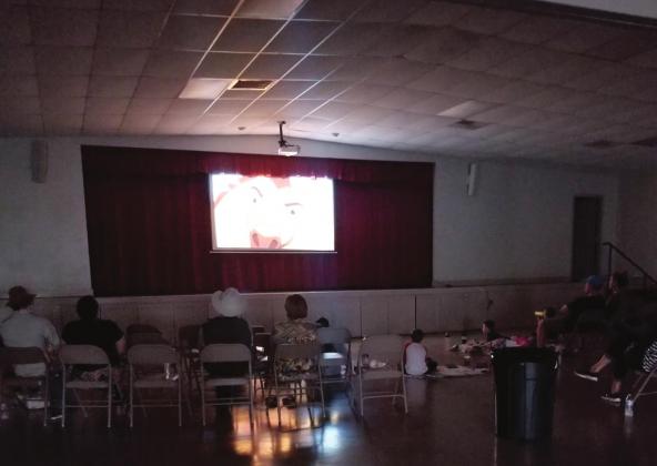 Locals enjoy a night at the movies during Meridian Parks and Rec’s free Outdoor Movie Night last Saturday. Unfavorable weather forced the event indoors but couldn’t stop the fun. Courtesy Photo