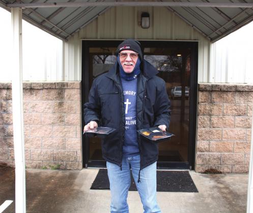 Senior Services volunteer Ken Beasley doesn’t let the cold weather stop him from bringing in hot meals to Bosque County senior citizens at First United Church in Meridian. Brook DeZavala | Meridian Tribune