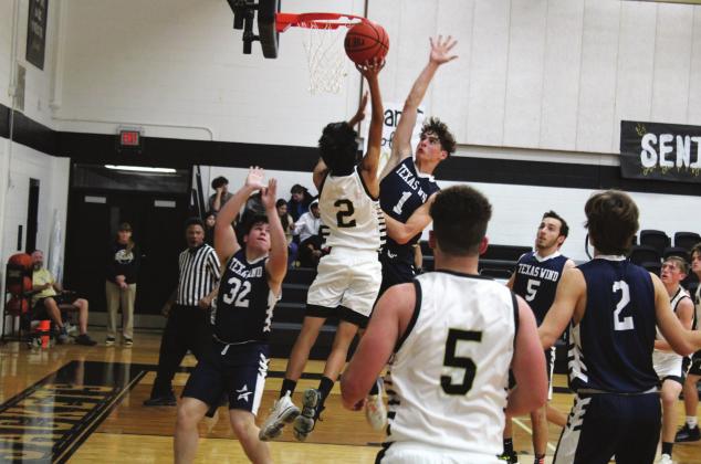 Junior Rodriguez soars high for a lay-up against Texas Wind. Brook DeZavala | Meridian Tribune