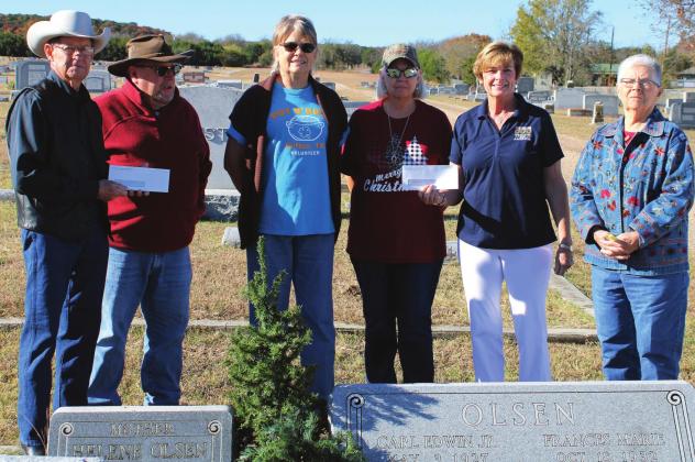 Pot ‘O Gold volunteers present Cranfills Gap and Clifton Wreaths Across America groups with $1,000 checks. From left is Grover McMains, Ron Hubbard, Helen Haas, Geneva Harvey, Kathy Harr and Iris Hodges. Ashley Barner | The Clifton Record