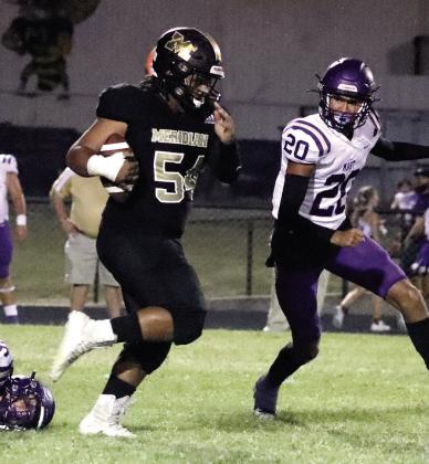 Jackets junior John Wyatt breaks away from pressure Friday against the Mart Panthers. Photo by Wendy Orozco Courtesy of Brett Voss’ The Sports Buzz
