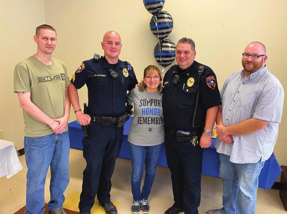 From left, Meridian Police Department officer Cody Woosley, Sgt. Sam Hathaway, Lucy Nowell, Chief Blake Johnson and Officer Gage Guinn remember Officer Nowell during National Police Week. Courtesy Photo
