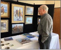 Wally Penberthy appraises the paintings of Martin Grelle at the First Presbyterian Church in Clifton’s “Year of the FPC Artists” exhibition in 2022. Courtesy Photo By First Presbyterian Clifton