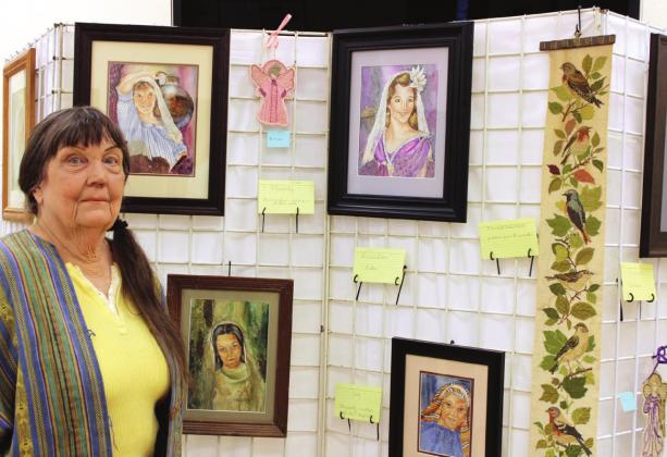 First Presbyterian Church member Elisabeth Montgomery showcases her watercolor collages of women in the Bible, along with needle art angels. Ashley Barner | The Clifton Record
