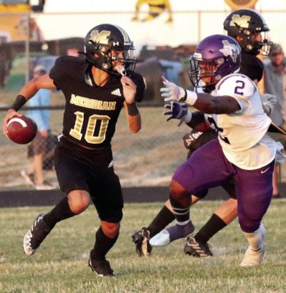 Meridian Yellow Jacket Matty Jones breaks away from pressure Friday against the Mart Panthers. Photo by Wendy Orozco Courtesy of Brett Voss’ The Sports Buzz