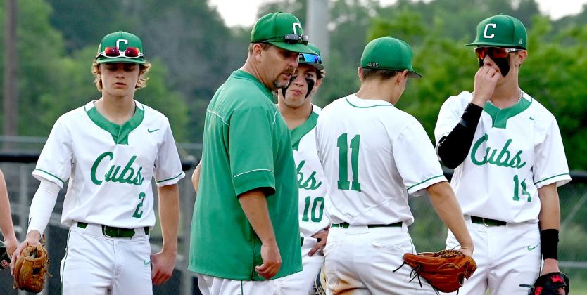 Clifton baseball head coach Brian Slater discusses strategy at mound meeting. Photo courtesy of Brett Voss’ The Sports Buzz