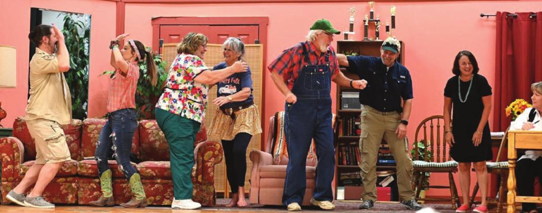 The cast of ‘Honky Tonk Hissy Fit’ prepares for opening night, Saturday, Oct. 16 at the Tin building Theatre. Pictured from left is Michael Richardson, Halie Patrick, Debbie Rollins, Carla Sigler, Bryan Davis, Brett Voss, Lorana Rush and Belinda Prince. Photo by Simone Wichers-Voss