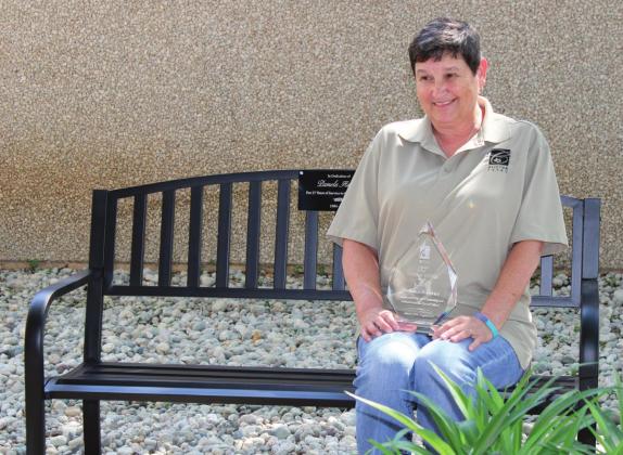 Pam Harvey is surprised by the bench placed in her honor for her years of dedication and hard work for the City of Clifton. Ashley Barner | The Clifton Record