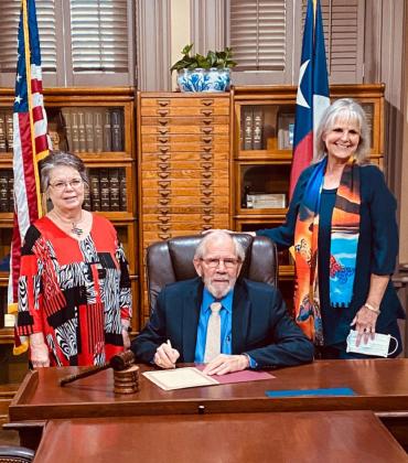 Bosque County Judge Don Poole (center) signs the proclamation for the observance of Constitution Week as witnessed by Chapter Regent Sue Fielden (left) and Chapter Officer Carla Sigler (right) for the Bosque River Valley Chapter, NSDAR. Courtesy Photo