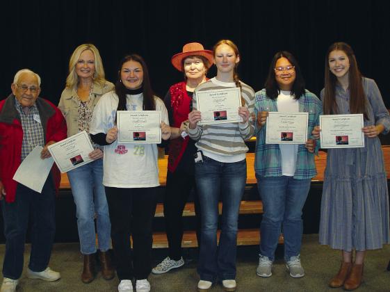 Area writers won big in the Bosque Arts Center’s Books on the Bosque Writing Contest. From left is Cleon Flanagan, Theo Boyd, Kaitlyn Baker, workshop leader and keynote speaker Nancy Robinson, Riley Ball, Chelsea Canapi, and Sophie Ritzmann. Not pictured are Kelsey Bryant, Richard Maxson, Beth Hatcher, Terence Cady, Kyndall Hunt, Royce Graham, E. Brett Voss and Patricia Schultheis. Photo courtesy of Bosque Arts Center