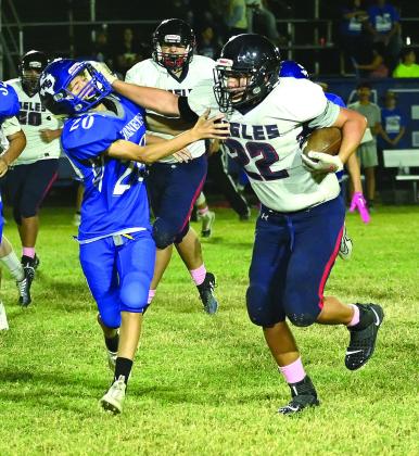 Walnut Springs and Kopperl battle it out on the field as Eagle sophomore Anthony Johnson keeps Hornet freshman Ashton Shuemake at an arm’s length. Photo Courtesy of Brett Voss’ The Sports Buzz