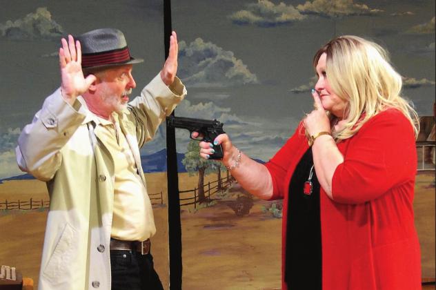 Gloria, played by Debbie Rollins portrays a bad gal turning the tables on private eye Don Boysen in a scene from the hilarious comedy “Bad Medicine.” The play opens for four performances at the Tin Building Theatre starting May 14. Photo Courtesy of Steve Schmidt