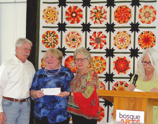 Ed and Phyllis Reiser present Judy Beskow (middle) with the Best of Show award at the 2022 BAC Quilt show for her Art Quilt entry, Octopus’ Garden. Also pictured is BAC program director Deb Phinney. Photo Courtesy of Bosque Arts Center
