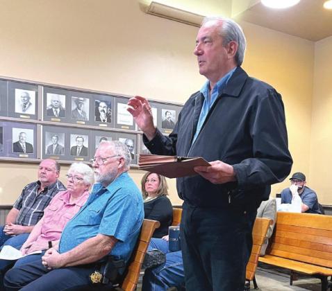 Steve Harr speaks on behalf of residents in Bosque County who oppose the building of wind turbines during Monday’s commissioners court meeting. Ashley Barner | Meridian Tribune