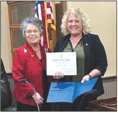 Photo by Bosque River Valley Chapter, NSDAR Sue Felden, Bosque River Valley Chapter, NSDAR, (from left) and Bosque County Judge Cindy Vanlandingham hold a resolution honoring Veitnam Veterans Day during a ceremony on Wednesday, March 27, at the Bosque County Courthouse in Meridian.