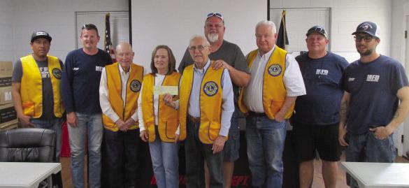 The Meridian Lions Club recently donated a check to the Meridian Volunteer Fire Department in honor of Earl Royal's 46 years with the Lions Club on his retirement. Attending were Lions President, Myron Lee and Secretary Patti Wagner and honoree Earl Royal. Courtesy Photo by Meridian Lions Club
