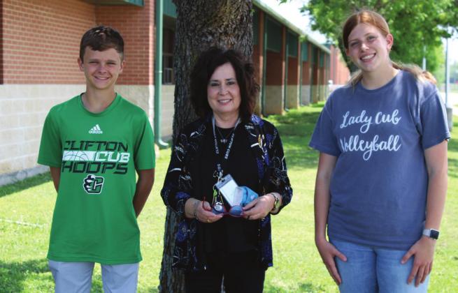 Two CHS students earned first place at the Texas Association for Pupil Transportation speech competition in Waco last week. From left, freshman Clay Kennedy, Honors English Teacher Gaye Lynn Seawright and sophomore Cami Ivy. Ashley Barner | The Clifton Record