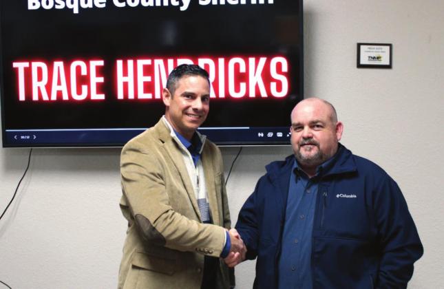 From left, WSCA president Justin Hunter thanks Bosque County Sheriff Trace Hendricks for speaking at the monthly meeting in Laguna Park last Tuesday. Ashley Barner | Meridian Tribune