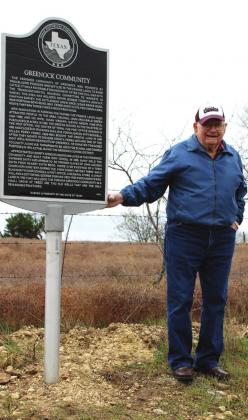 Dugan Dorman proudly shows off the historical marker on FM 2490 recognizing the community of Greenock, which no longer stands today. A pile of lumber from the schoolhouse and two old wells are the only traces left of the community which helped shape the southeastern part of Bosque County. Ashley Barner | Meridian Tribune