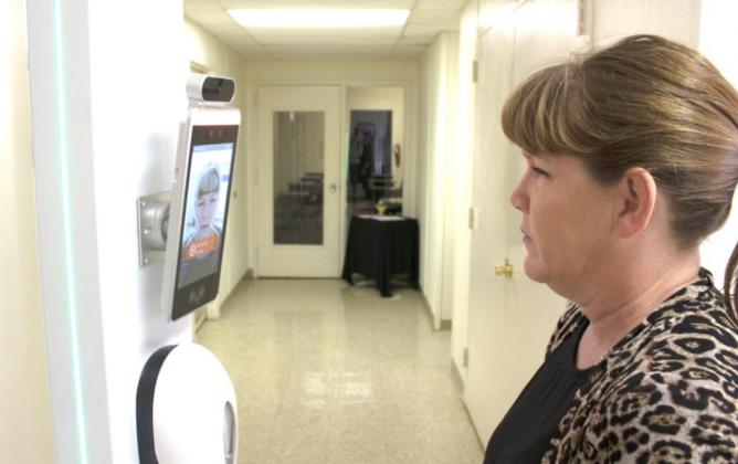 Kim Edwards demonstrates a new temperature scanner Tuesday that Meridian ISD will be using on students before they can enter the campus building. Allen D. Fisher | Meridian Tribune