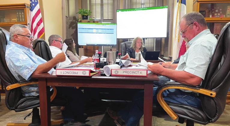 Commissioners mull over figures during the 2021-2022 budget workshop during Monday’s Commissioners Court meeting. From left and around the table is Billy Hall, Terry Townley, Darcie Ragsdale, Cindy Vanlandingham, Larry Philipp and Ronny Liardon. Ashley Barner | The Clifton Record