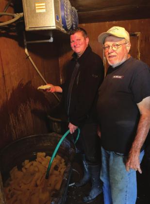 From left, Scott Reierson and Kenneth Reierson add more water to the codfish in preparation for Saturday’s Lutefisk feast in Cranfills Gap. Courtesy Photo